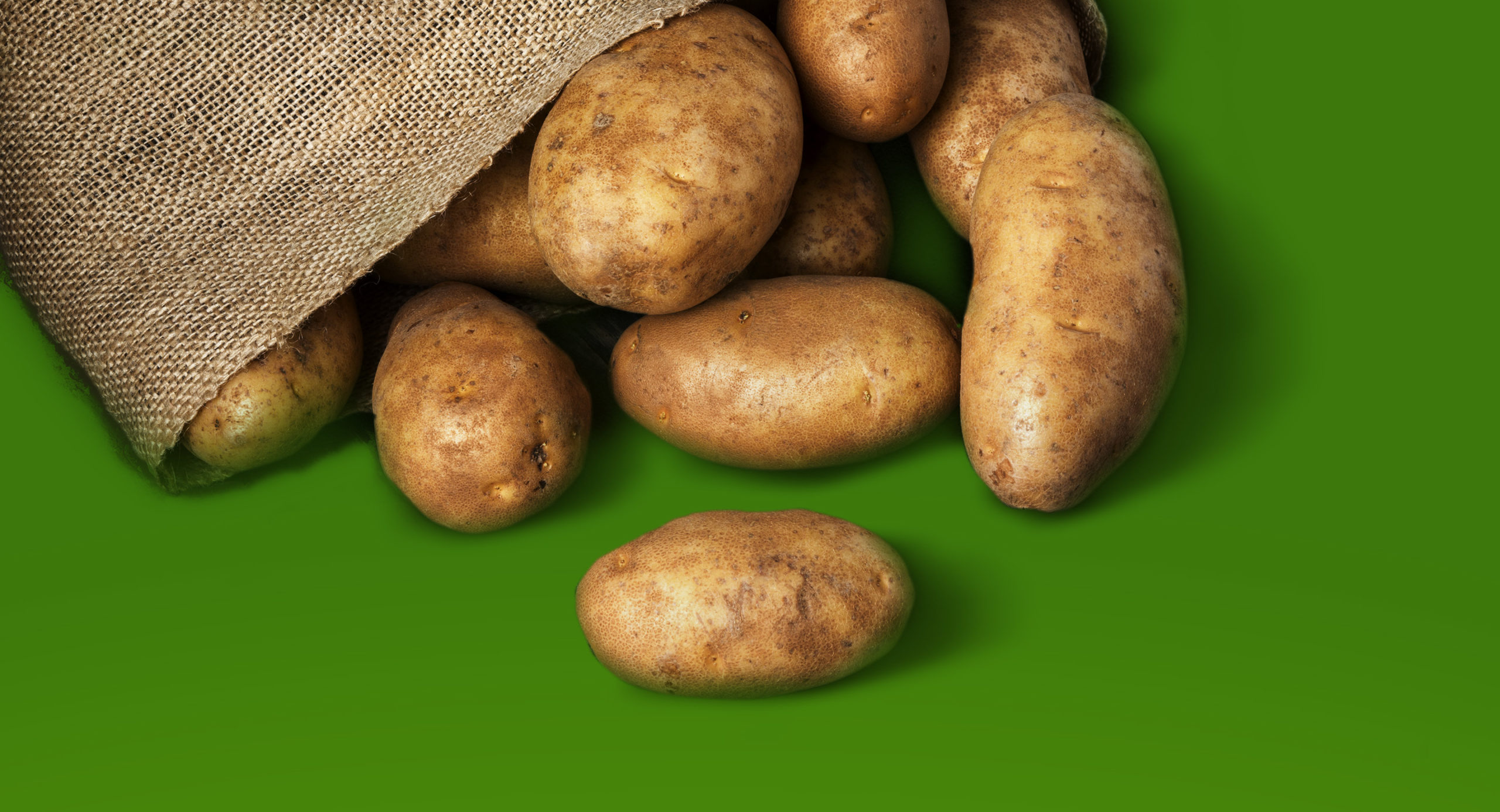 Image of Potatoes on a Green Background